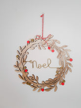 Load image into Gallery viewer, Christmas wreath decoration customizable family name wreath of leaves and wooden mistletoe pompoms to hang on a door, wall
