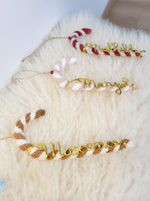 Load image into Gallery viewer, Barley sugar decoration to hang on the Christmas tree in customizable recycled cotton knit with golden first name
